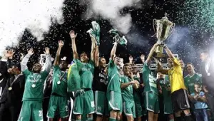 PFC Ludogorets players celebrate with a trophy at end of their Bulgarian Championship final soccer match against CSKA Sofia in Razgrad